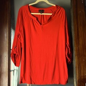 Burnt orange 3/4 top. Soft feeling fabric.